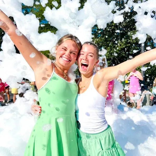 Friends celebrating together at a foam party